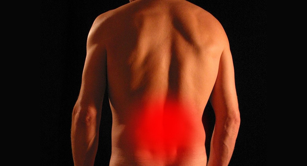 Man's back, with back pain, sciatica, lower spine disk issues 
